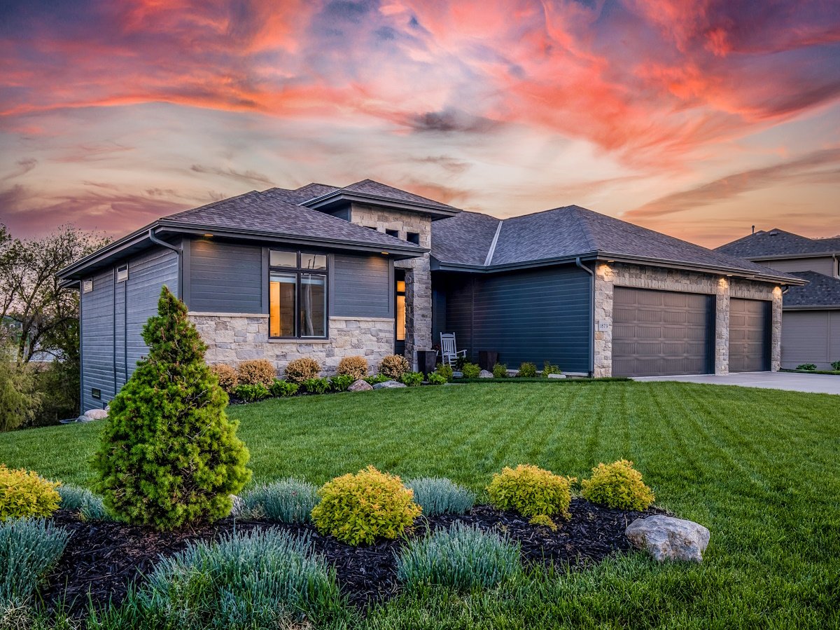 home with new roof and siding at sunset